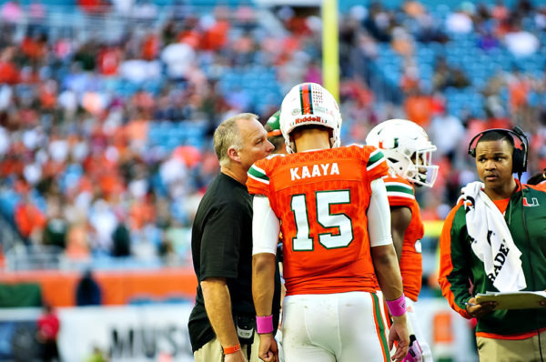 Hurricanes head coach, Mark Richt, talks to Brad Kaaya during a timeout