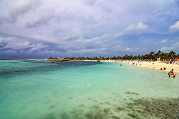 Cruisers aboard the Disney Magic frolic on the beaches and water at Castaway Cay