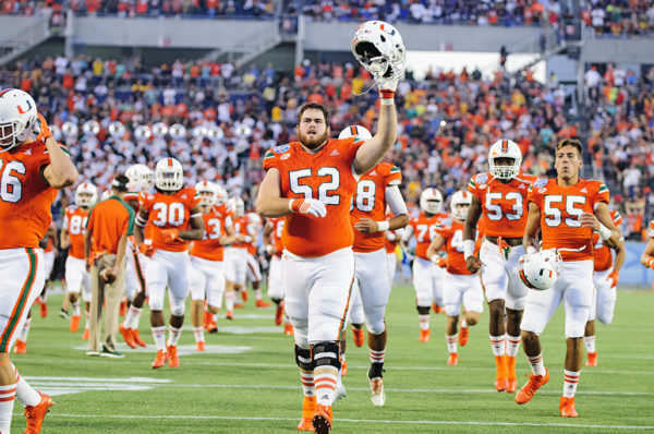 KC McDermott, acknowledges the crowd as the Hurricanes run onto the field