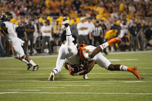 Miami Hurricanes LB, Zach McCloud, takes down West Virginia RB, Justin Crawford