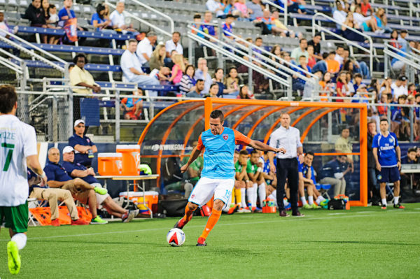 Miami FC defender, Hunter Freeman, passes the ball