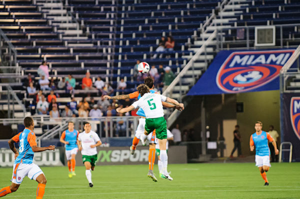 New York Cosmos defender, Dejan Jakovic, heads the ball