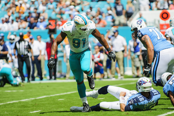 Cameron Wake walks over Matt Cassel