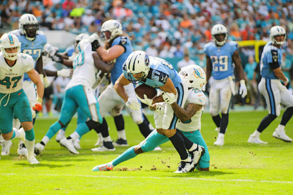 Eric Decker gets tackled by Xavier Howard
