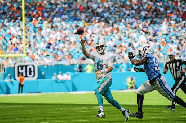 Dolphins QB, Jay Cutler, throws the pass out of bounds to avoid a sack