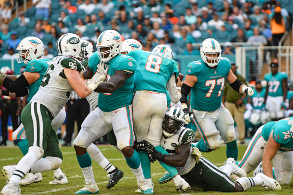 New York Jets linebacker Jeremiah Attaochu (55) sacks Miami Dolphins quarterback Brock Osweiler (8)