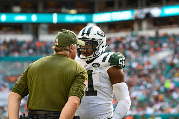 New York Jets outside linebacker Brandon Copeland (51) talks to coach Kevin Greene