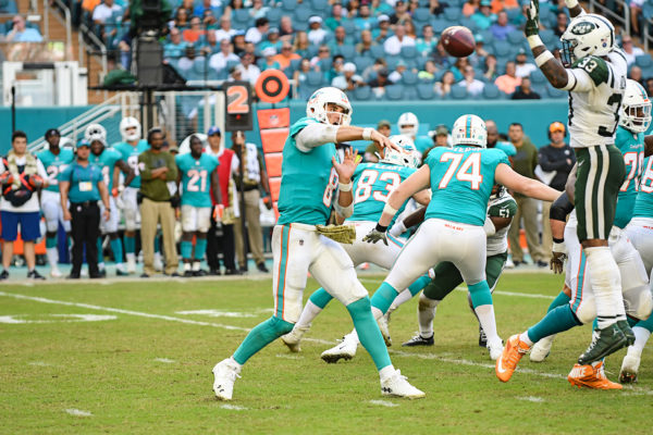 New York Jets strong safety Jamal Adams (33) tries to bat down the past Miami Dolphins quarterback Brock Osweiler (8)