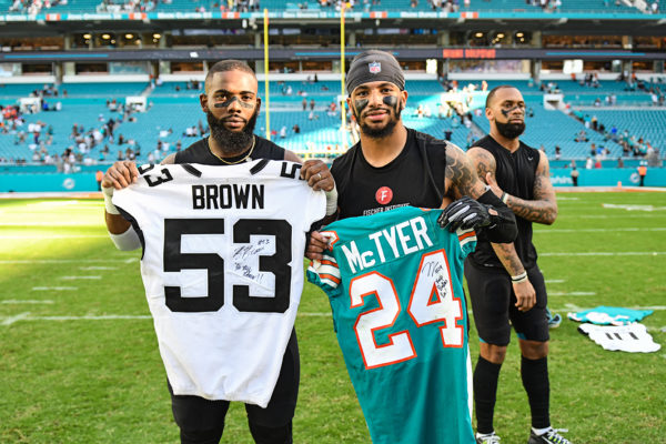 Jacksonville Jaguars linebacker Blair Brown (53) and Miami Dolphins cornerback Torry McTyer (24)