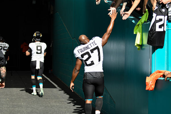 Jacksonville Jaguars running back Leonard Fournette (27) slaps hands with fans before the game