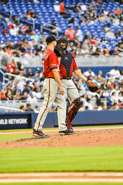 Washington Nationals starting pitcher Max Scherzer #31 talks with Washington Nationals catcher Yan Gomes #10 on the mound